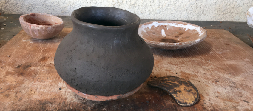 primitive pot being formed