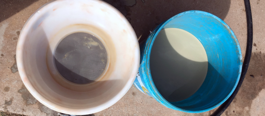 clay being screened in buckets