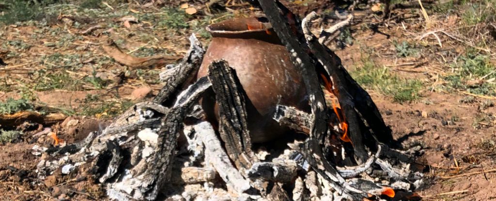 an open outdoor pottery firing
